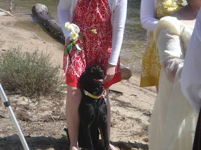 Sarah holding Cheyenne between her legs, so she couldn't jump in the lake
